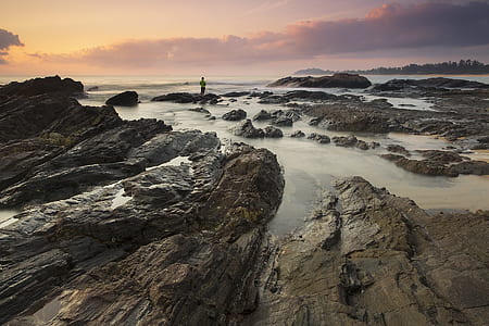 Brown Stone Beside Body of Water thumbnail
