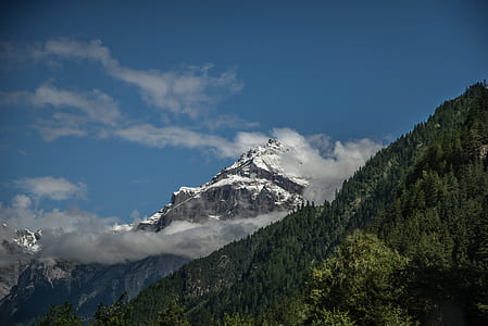 White and Green Mountain Under White Clouds thumbnail
