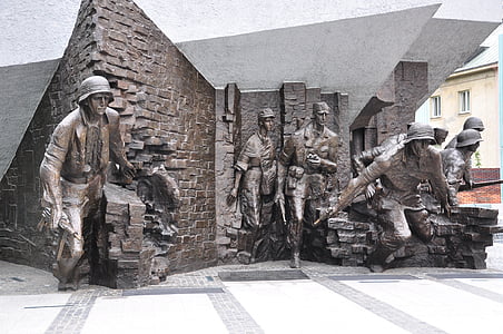 group of soldier statue near concrete wall thumbnail