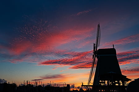 silhouette of farm windmill during sunset thumbnail