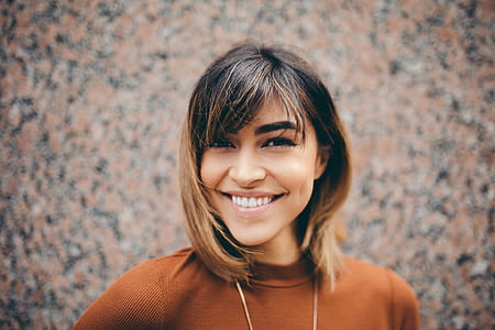 woman wearing brown shirt closeup photography thumbnail