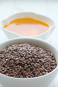 brown beans and orange liquid on white ceramic bowl thumbnail