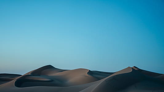 photo of brown rocky sand during daytime thumbnail