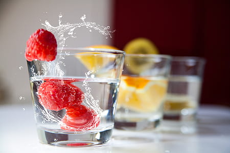 three clear rocks glasses filled with white liquids thumbnail