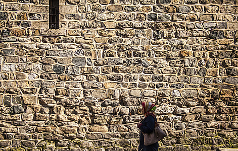 woman standing in front of wall thumbnail
