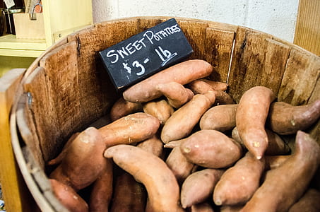 bunch of sweet potatoes on barrel thumbnail