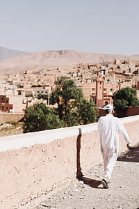 man walking on building roof thumbnail