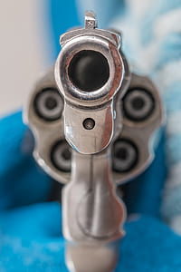gray revolver pistol in selective focus photography thumbnail