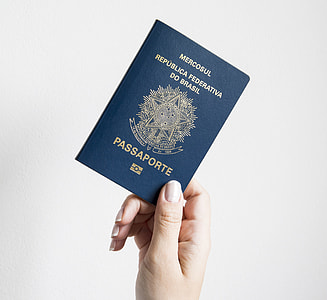 person holding passport thumbnail