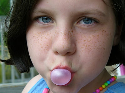girl playing with bubblegum thumbnail