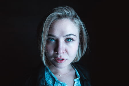 woman wearing blue collared top thumbnail