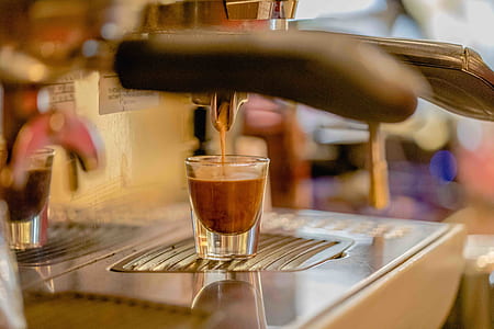 clear drinking glass on silver espresso maker thumbnail