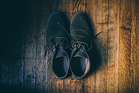 black leather shoes on brown surface thumbnail