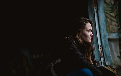 woman starring at the window thumbnail
