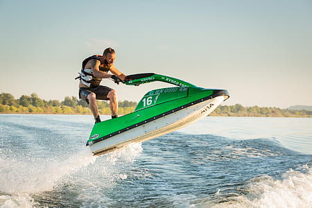 man using personal watercraft during daytime thumbnail