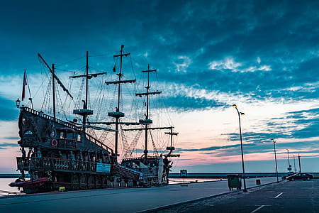 silhouette photo of sailship thumbnail