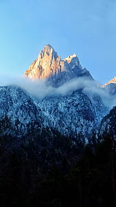 snow covered mountain under blue sky during daytime thumbnail