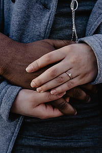 closeup photo of person wearing gray zip-up jacket thumbnail