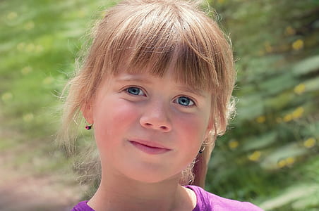 smiling girl wearing pink shirt at daytime thumbnail