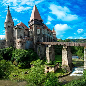 photo of brown stone castle with bridge thumbnail