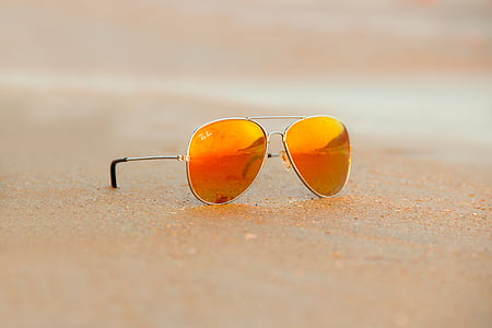 gray framed Ray-Ban orange flash lens Aviator sunglasses on brown sand thumbnail