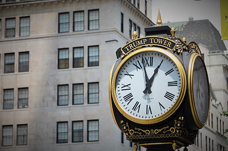 black and white trump tower clock in front of gray painted building thumbnail