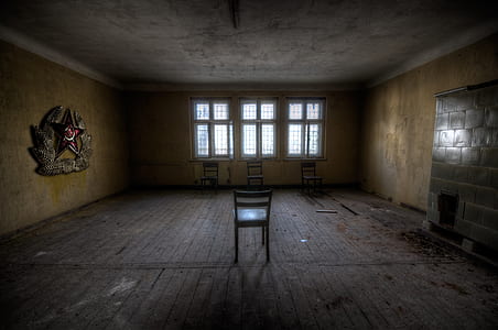 four brown wooden chairs inside enclosed room thumbnail