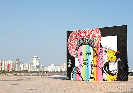 man's face and yellow tiger wall graffiti thumbnail