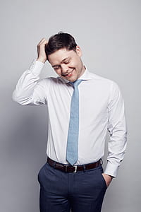 woman wearing white dress holding his hair thumbnail