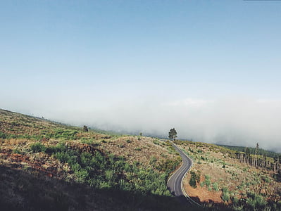 road and mountain during daytime thumbnail