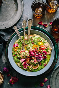cooked food in blue bowl near drinking glass thumbnail