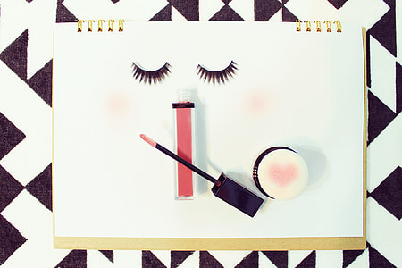 false eyelashes and makeup kits on paper thumbnail