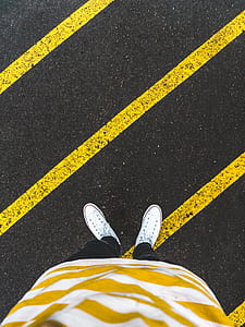 person wearing white low-top sneakers thumbnail