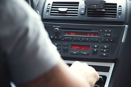 person in white shirt inside car thumbnail