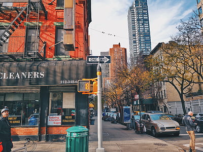 man standing beside the building thumbnail