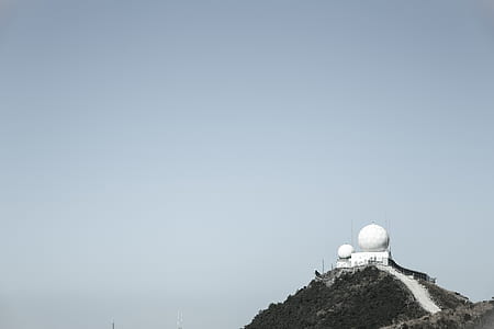 white building on cliff thumbnail