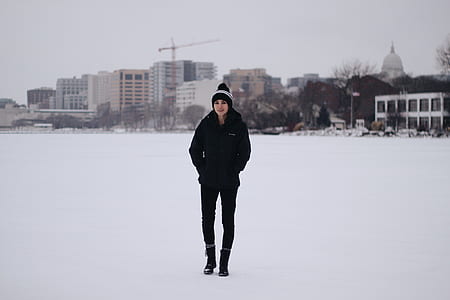 woman wearing black jacket standing on snow thumbnail