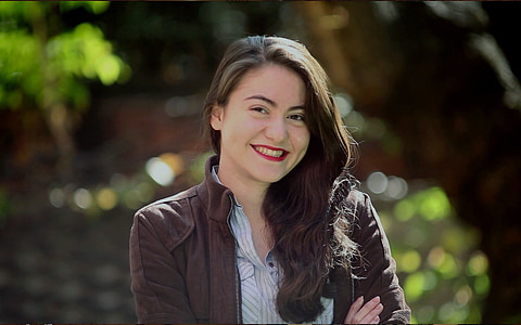 woman wearing brown jacket thumbnail