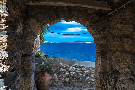 photo of gray concrete house near sea thumbnail