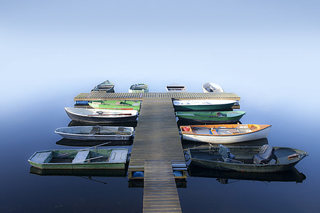 assorted-color boats on blue body of water thumbnail