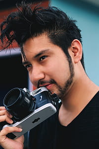 Man Holding Camera thumbnail