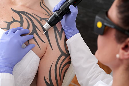 woman doing tattoo thumbnail