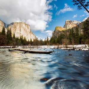 rocky mountain and body of water during daytime thumbnail