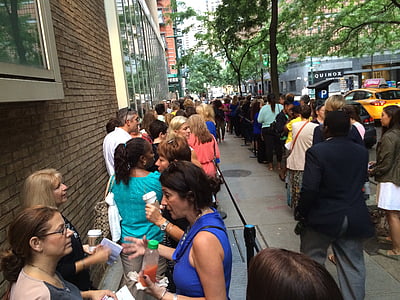 people waiting in line on sidewall during daytime thumbnail