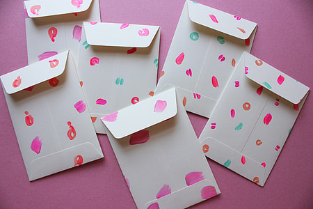 six white-and-multicolor envelopes on pink surface thumbnail