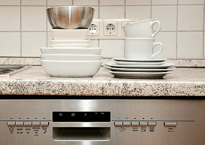 white ceramic plates, bowls, and cups on brown marble tile thumbnail