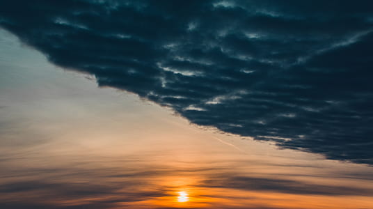 dark clouds during sunset thumbnail