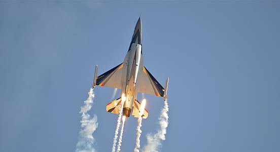 aerial photography of plane with smokes thumbnail