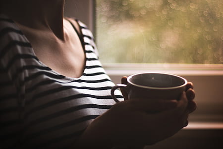 person holing ceramic cup thumbnail