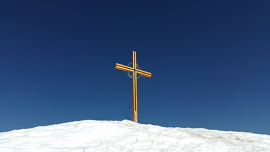 brown cross on snowfield thumbnail